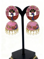 Pair of pink peacock earrings with pearl details on a black stand.