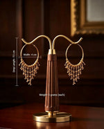 Pair of 22K gold-plated beaded tassel hoop earrings on wooden & brass stand with marked dimensions: drop length 7.5 cm, width 4 cm, weight 5 grams per earring — luxury Pakistani jewellry.