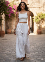 White Cotton Chikankari Flared Trousers – Hand-Embroidered Ethnic Bottoms by Famaza Couture