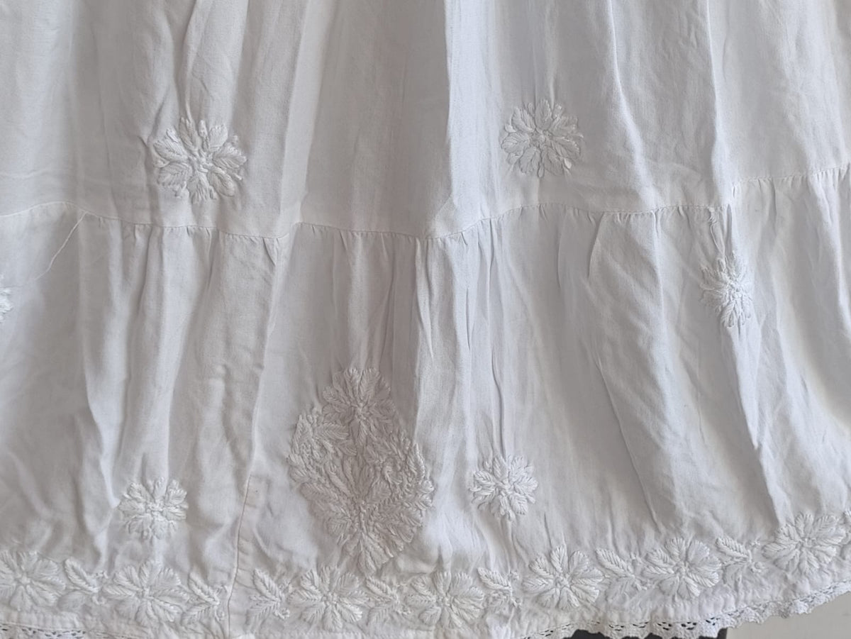 White premium rayon skirt with dense ghasspati work on bottom two flare layers