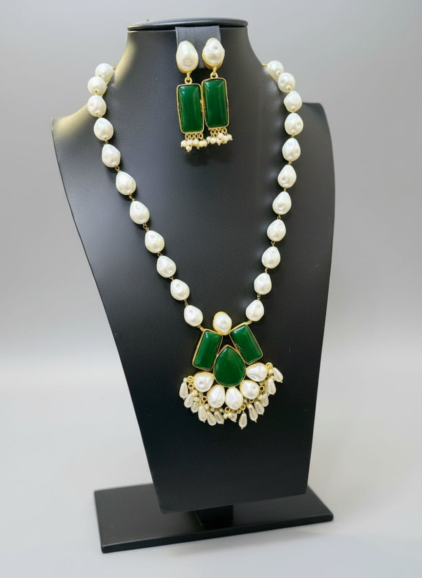 A luxury Bollywood style Mala Set featuring white beads, pearls, and bottle green stones inclusions, displayed on a mannequin bust. Party wear set. 