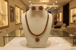 A Gold plated Jewellery set with necklace and studs in Red & Green Floral Kundan 