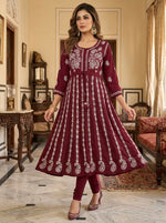 A Model is showing the front view of this Maroon chikankari hand embroidered Aanarkali long dress.