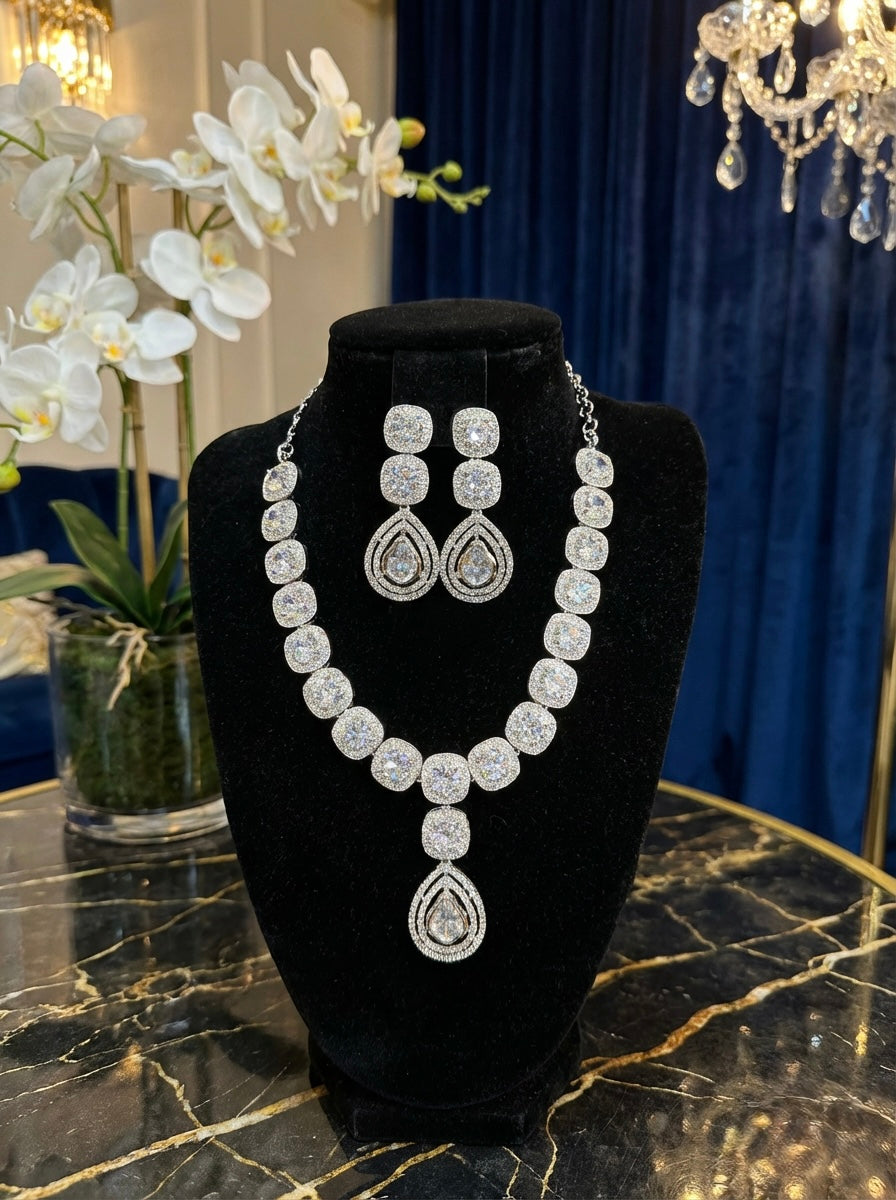 A Model is wearing American diamonds necklace and earrings jewellery set. 
