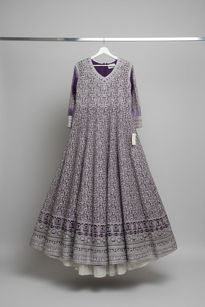 A Purple floor length bridal tail maxi dress with fully machine zari work all over the maxi dress 