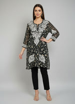 A black colour georgette kurti with floral chikankari printed and hand embroidered motifs.