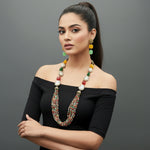 A black mannequin showcasing a Bollywood style Mona Lisa stone and crystal beaded Mala set, with multiple colours of beads and gold-tone accents.