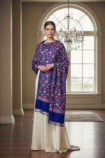 A blue colour pashmina scarf with Kashmiri embroidery in a floral pattern, featuring tassels on the ends.