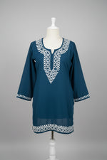 Close-up detail of authentic Lucknowi Chikankari white thread embroidery on soft rayon kurti