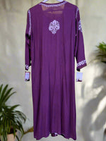 A floral embroidered purple kurta set with palazzo trousers.