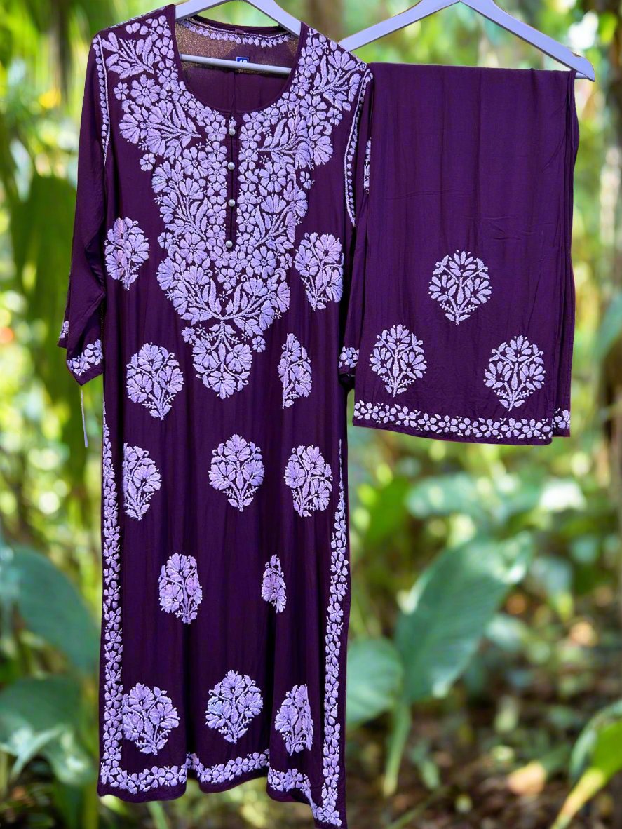 A floral embroidered purple kurta set with palazzo trousers.