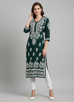 A fully hand embroidered bottle green colour modal fabric 46 inches long kurti with white floral motifs and detailed border work.
