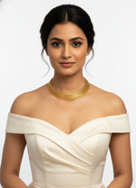 A gold plated multi layer Hasli necklace by famaza couture 