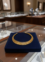 A gold-tone multi-layer Hasli necklace jewellery set by famaza couture 