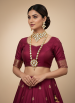 A gold-toned Kundan oval choker necklace and mala necklace with polki kundan embellishments and matching earrings by famaza couture 