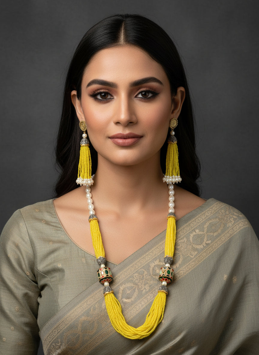 A luxurious Tanjore Art Meenakari beaded Mala Set featuring a bridal pearl necklace with accompanying earrings, predominantly in gold and white colors with ornate designs.