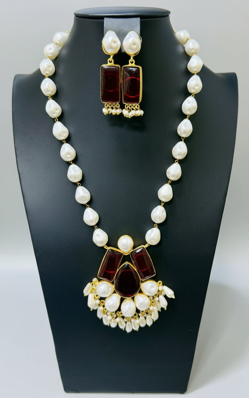 A luxury Bollywood style Mala Set featuring white beads, pearls, and maroon stones inclusions, displayed on a mannequin bust. Party wear set.