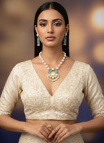 A luxury Bollywood style Mala Set featuring white beads, pearls, and ocean blue and yellow stone inclusions, displayed on a mannequin bust. Party wear set. 