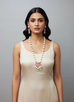 A luxury Bollywood style Mala Set featuring white beads, pearls, and pinkstone inclusions, displayed on a mannequin bust. Party wear mala set. 
