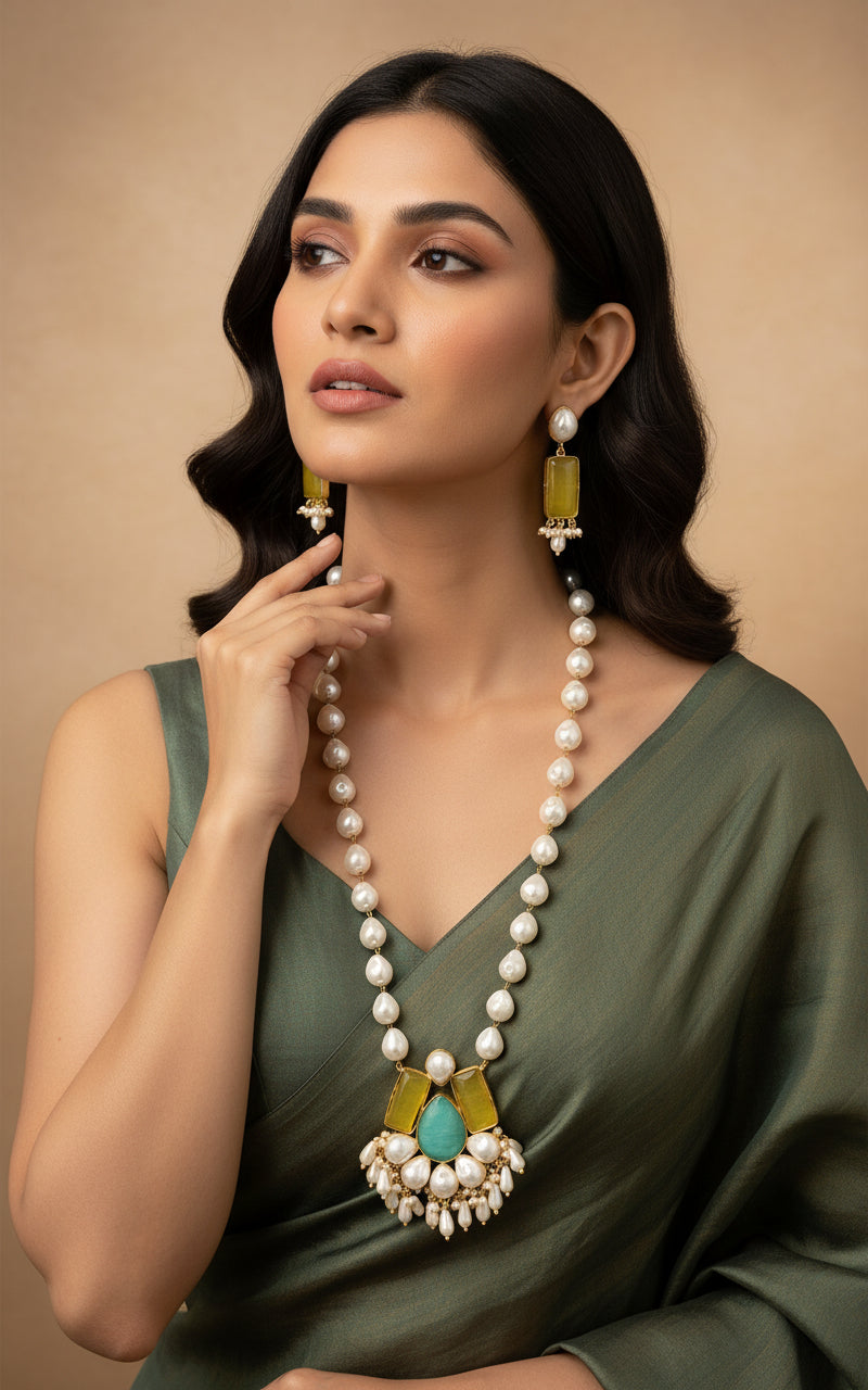 A luxury Bollywood style Mala Set featuring white beads, pearls, and yellow and turquoise stone inclusions, displayed on a mannequin bust. Party wear set.