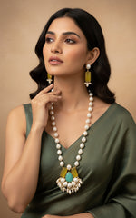 A luxury Bollywood style Mala Set featuring white beads, pearls, and yellow and turquoise stone inclusions, displayed on a mannequin bust. Party wear set.