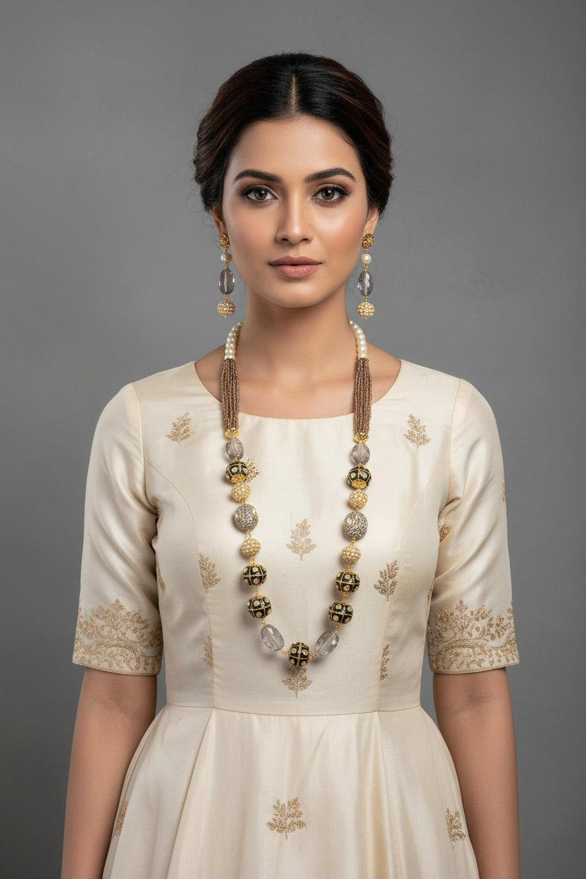 A luxury Tanjore Art Meenakari beige beaded Mala Set, featuring a regal bridal necklace and matching earrings with grey and gold details. 