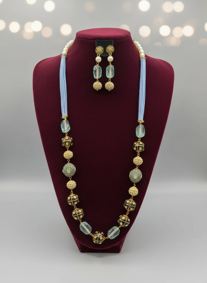 A luxury Tanjore Art Meenakari sky blue beaded Mala Set, featuring a regal bridal necklace and matching earrings with sky blue and gold details. Party wear set.