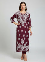 A maroon colour modal fabric 46 inches long kurti with white thread hand embriodery all over the kurti, sleeves and daaman.
