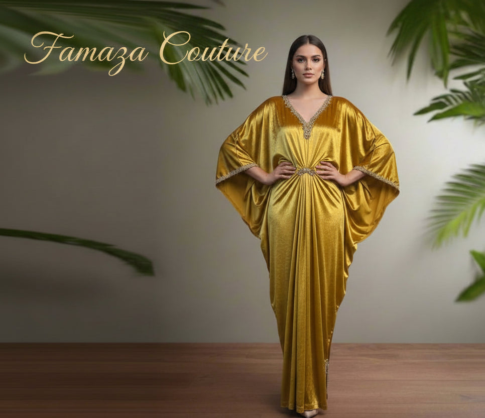 A mustard velvet kaftan dress displayed on a mannequin, featuring a batwing sleeve design and a V-neckline.