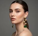 A pair of gold-plated earrings with bottle green Monalisa stone and coin details.