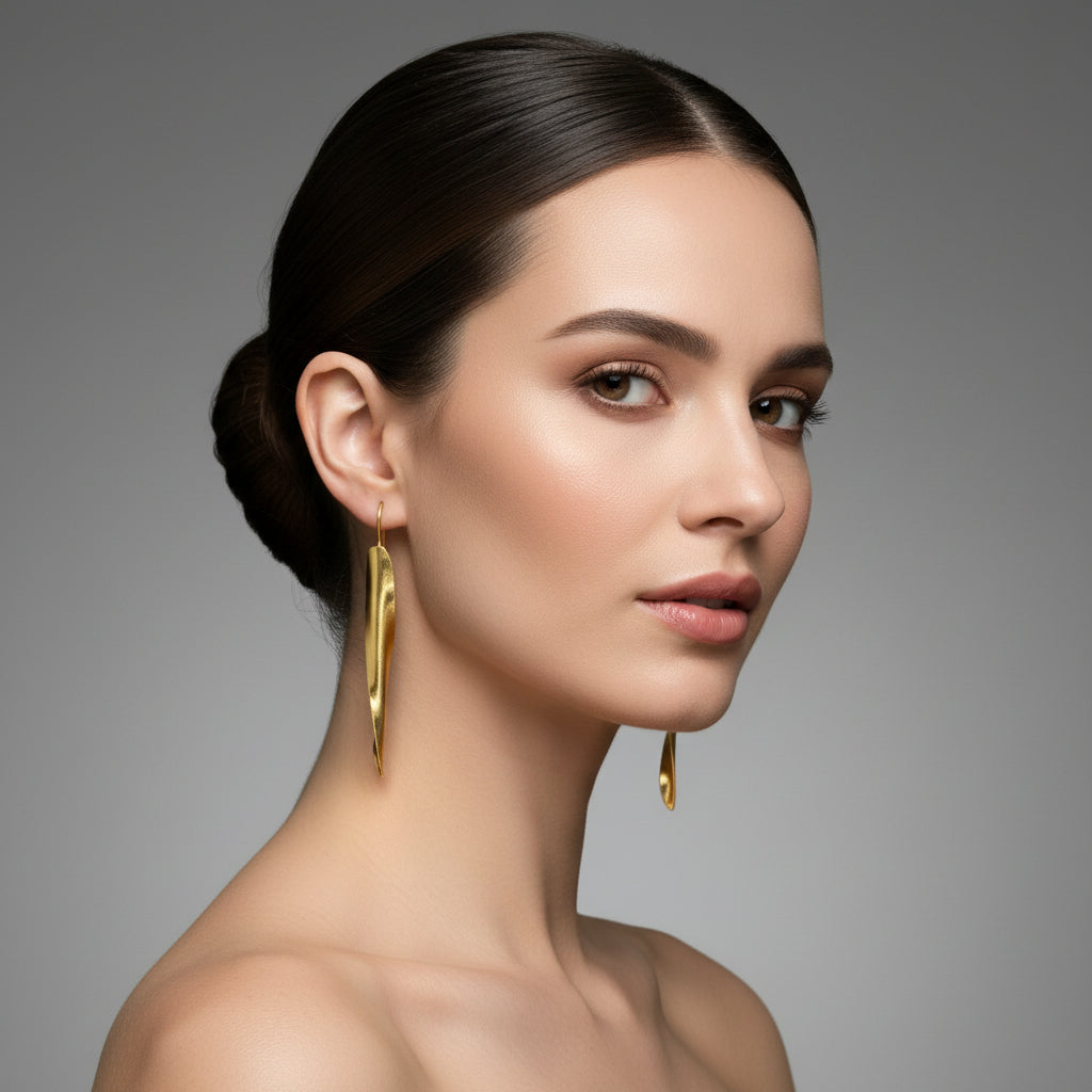 Golden drop twisted earrings – handcrafted statement jewellery