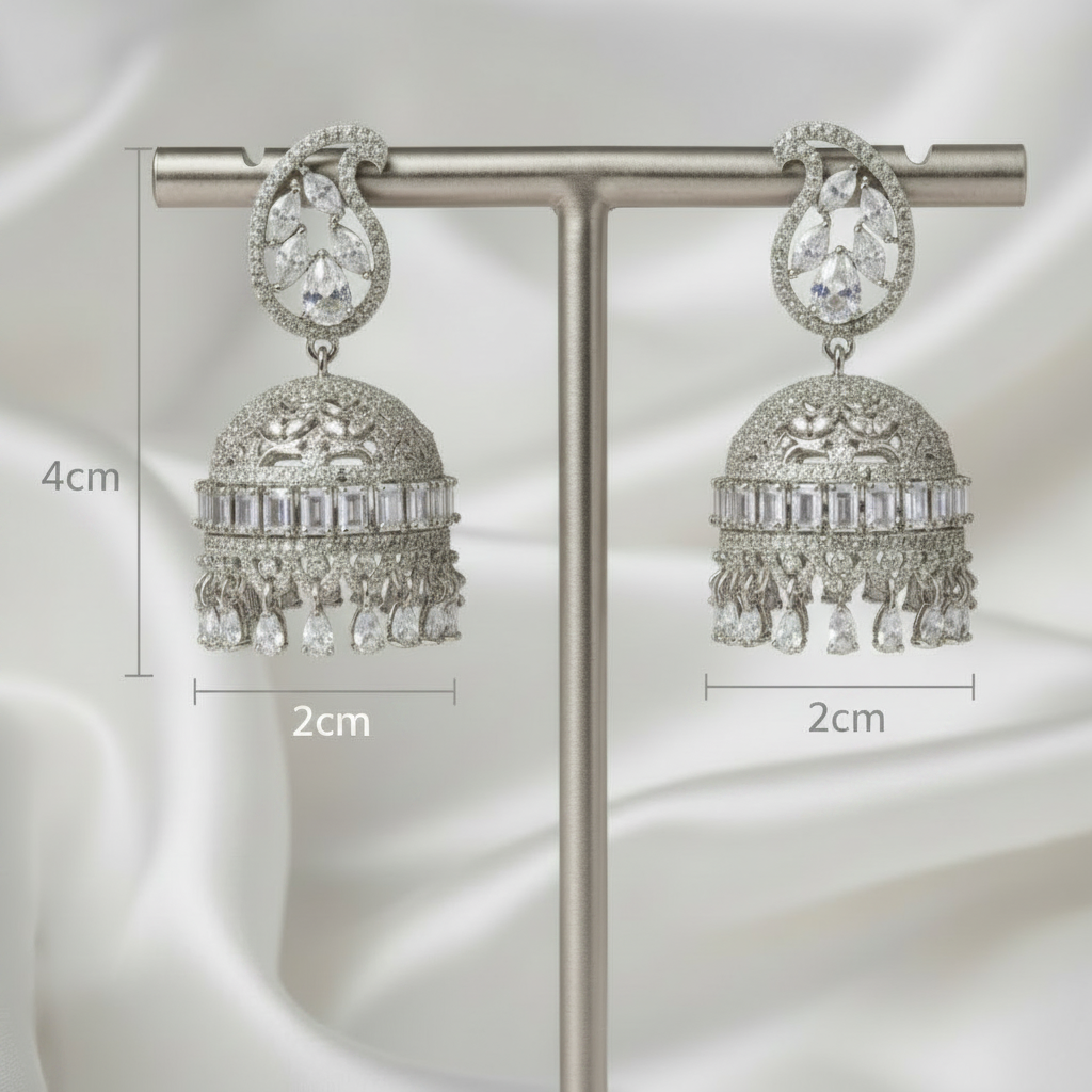 A pair of silver-toned jhumka earrings displayed on a metal T-stand against a dark gray background, with measurement labels indicating 4 cm height, 4 cm width on the left earring, and 2 cm width on the right earring.