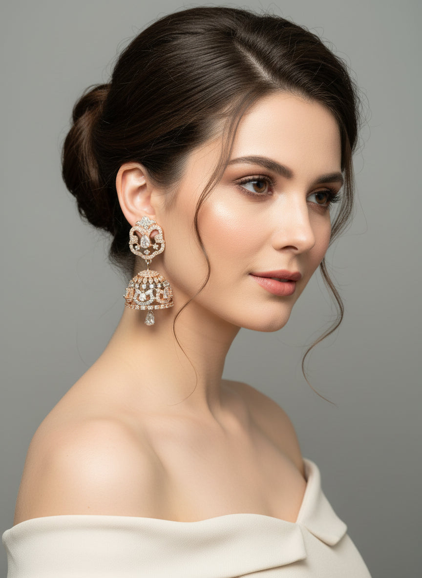 A pair of small handcrafted black polish American diamond jhumka earrings with a black and rose gold stones.