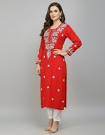 A red colour modal fabric chikankari kurti with white hand embroidery in a Ghass Patti pattern and booti work.