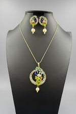 A rhodium-gold plated brass pendant with a peacock design accompanied by earrings, featuring vibrant green, blue, and gold enamel accents, as well as white and turquoise AD stones sparkling embellishments. Party wear set. 