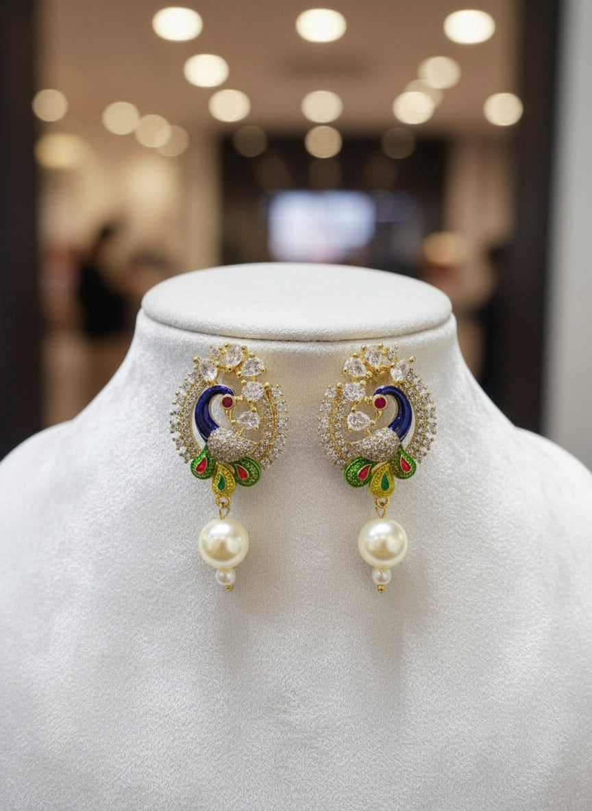 A rhodium-gold plated peacock design accompanied earrings, featuring vibrant green, blue, enamel accents, as well as sparkling crystal white AD stones. Earrings design is focused. 