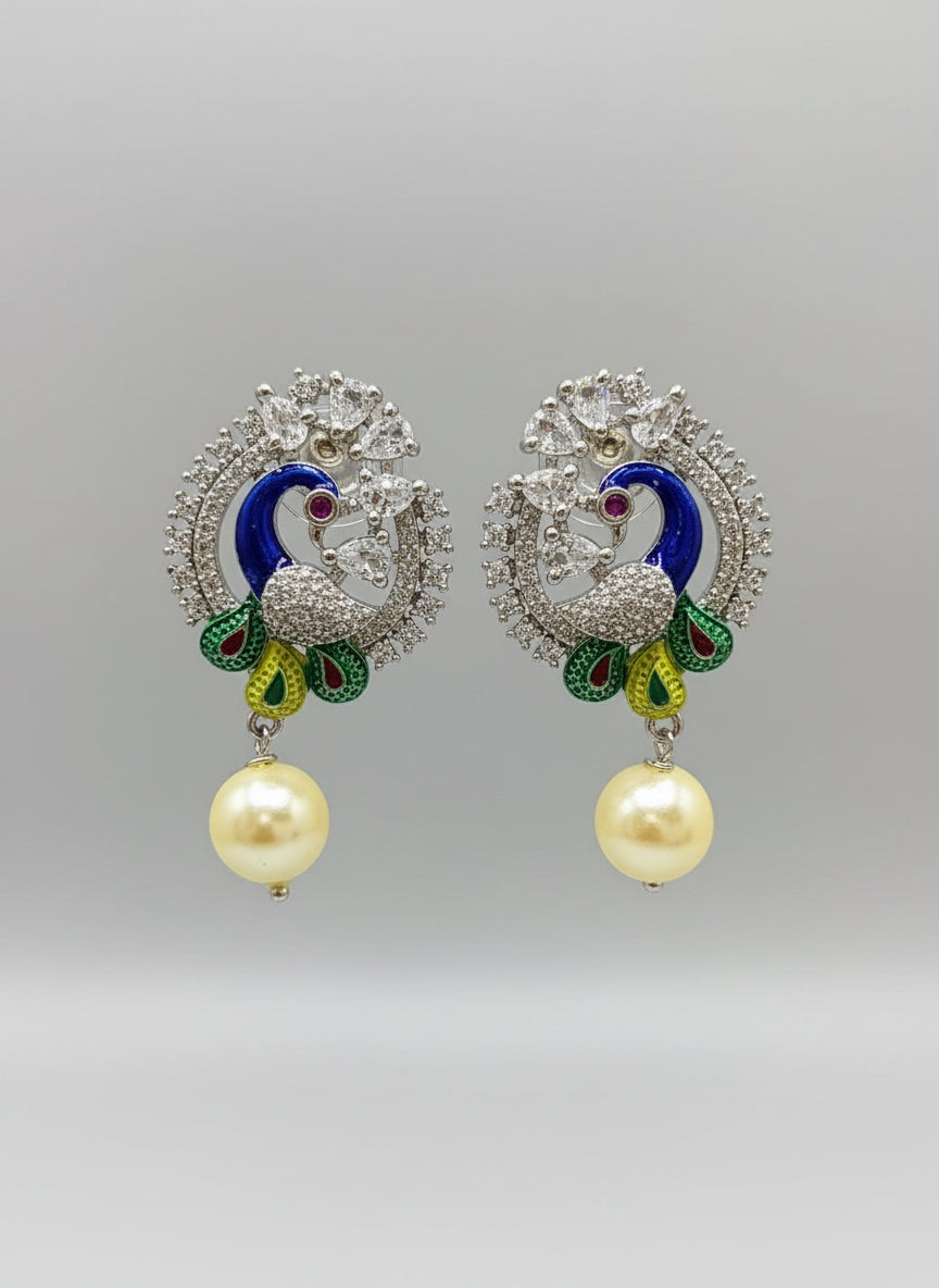 A rhodium-silver plated peacock design accompanied earrings, featuring vibrant green, blue and yellow enamel accents, as well as sparkling white andwhite AD crystal stones. Earrings design is focused. 
