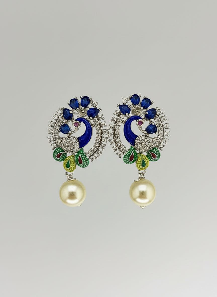 A rhodium-silver plated peacock design accompanied earrings, featuring vibrant green, blue, enamel accents, as well as sparkling crystal white and blue AD stones. Earrings design is focused. 