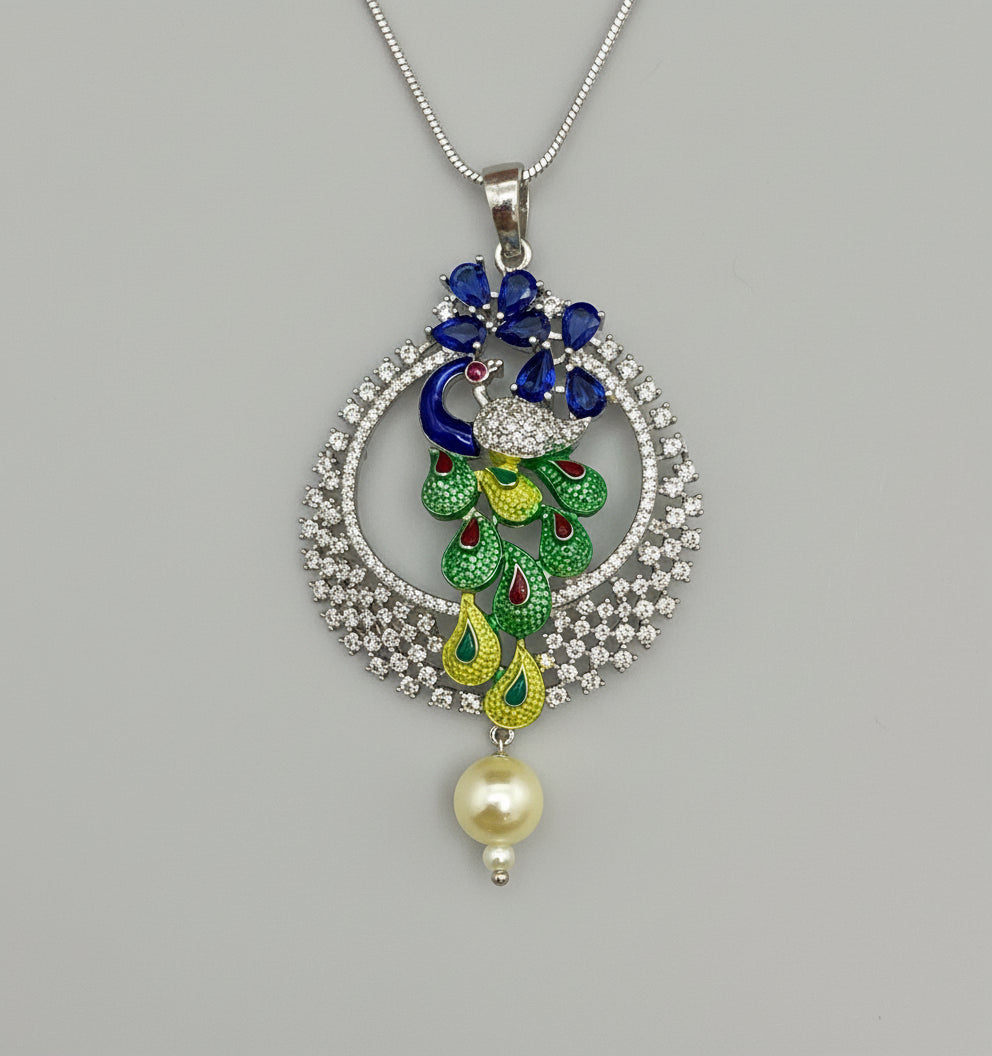 A rhodium-silver plated peacock design pendant with silver chain ,featuring vibrant green, blue, enamel accents, as well as sparkling crystal white and blue AD stones. Pendant with silver chain design is focused.