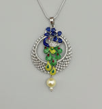 A rhodium-silver plated peacock design pendant with silver chain ,featuring vibrant green, blue, enamel accents, as well as sparkling crystal white and blue AD stones. Pendant with silver chain design is focused.