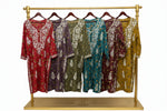 A selection of long kurta-shirts in various colors, each featuring intricate floral embroidery across the front.
