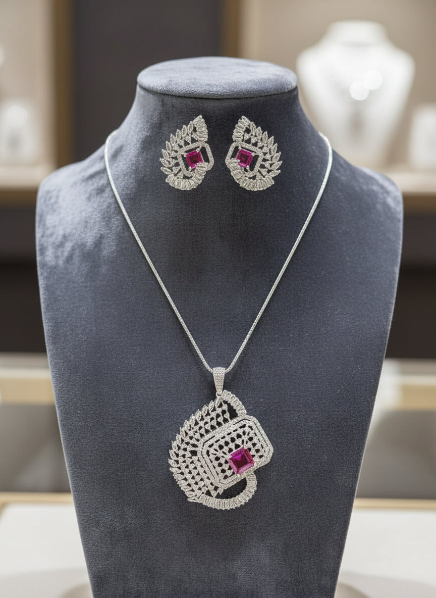 A set of artificial AD pendant and earrings with ruby pink centre stone, featuring a geometric design with intricate detailing, displayed on a mannequin. Party wear set. 