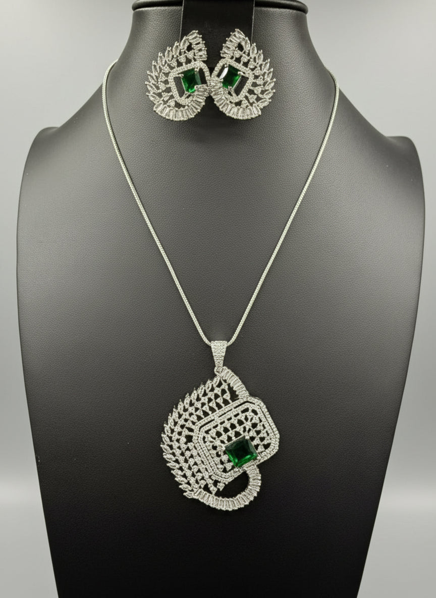 A set of artificial AD pendants with bottle green centre stone in the pendant and in earrings, featuring a geometric design with intricate detailing, displayed on a mannequin. Party wear set.