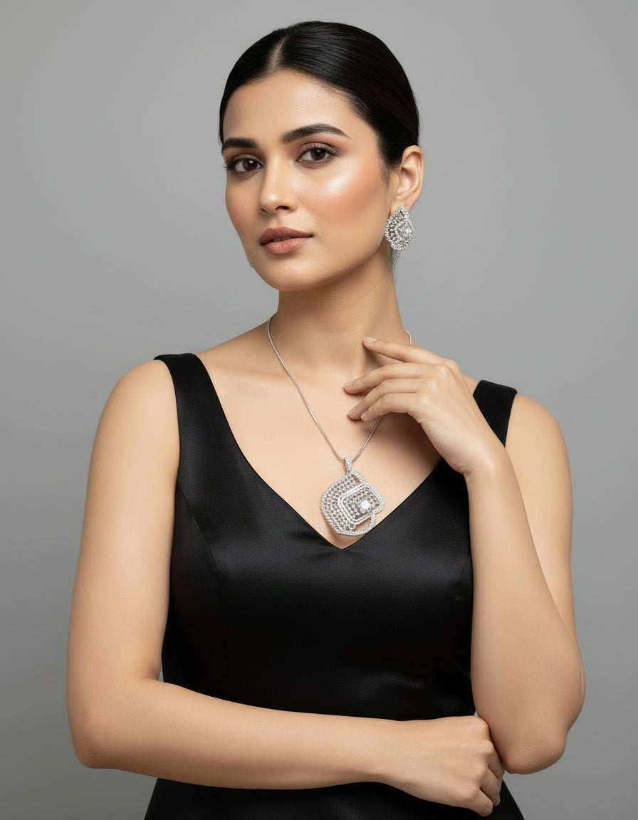A set of artificial AD pendants with earrings, featuring a geometric design with intricate detailing, displayed on a mannequin.