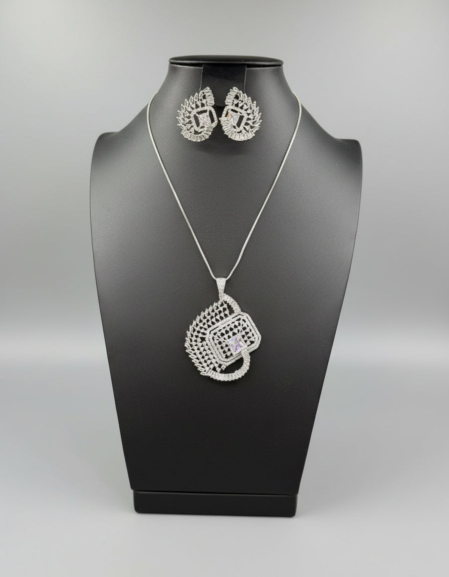 A set of artificial white AD stones pendants with earrings, featuring a geometric design with intricate detailing, displayed on a mannequin.