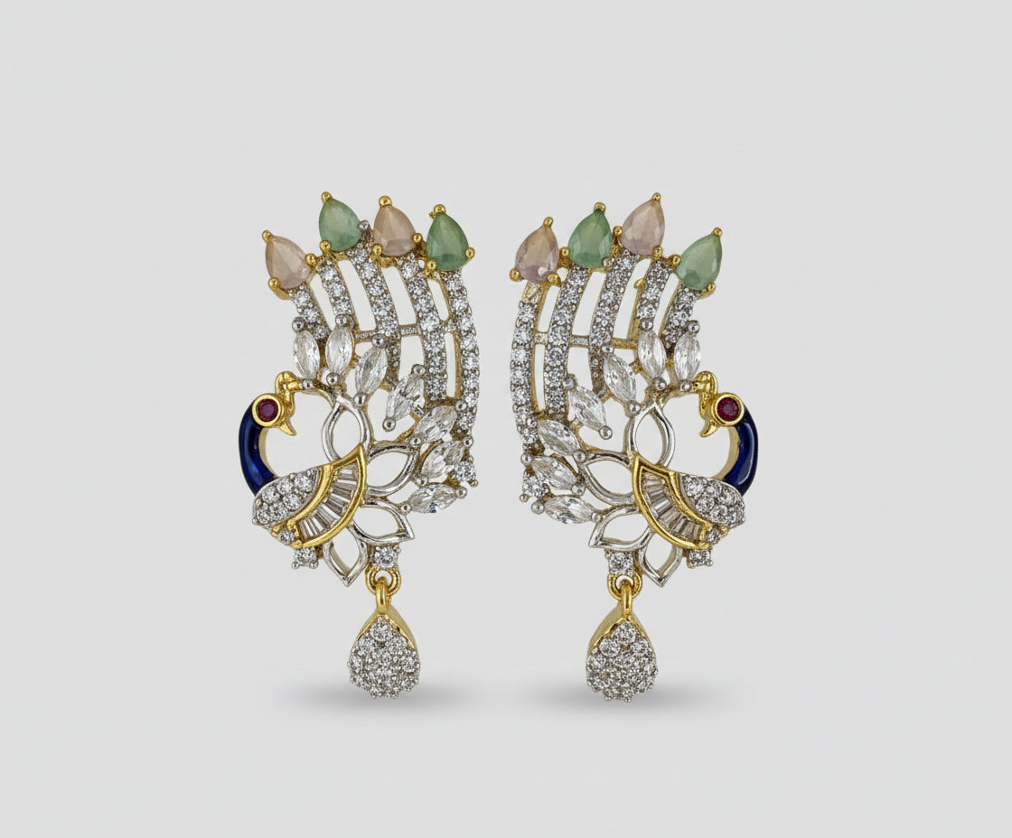 A set of peacock-shaped earrings. The earrings are detailed with blue enamel and has sparkling white and pink AD crystal embellishments. Party wear Earrings. 
