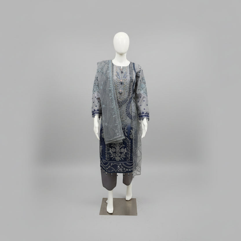 A side view and showing sleeves work of Net fabric in grey and navy blue two tone 3pcs Pakistani dress with hand embellishments on all over kurti and dupatta with plain grey silk straight trousers .
