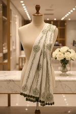 A white base colour handcrafted Kota Doriya Chikankari with green thread Hand-embroidered duppata by Famaza Couture. 