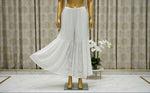 A white flared hand embroidered gharara trousers 