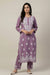  A woman is wearing a purple base rayon fabric 45 inches long kurti and 38 inches long trousers with white hand embroidered outfit with a purewhite background. 